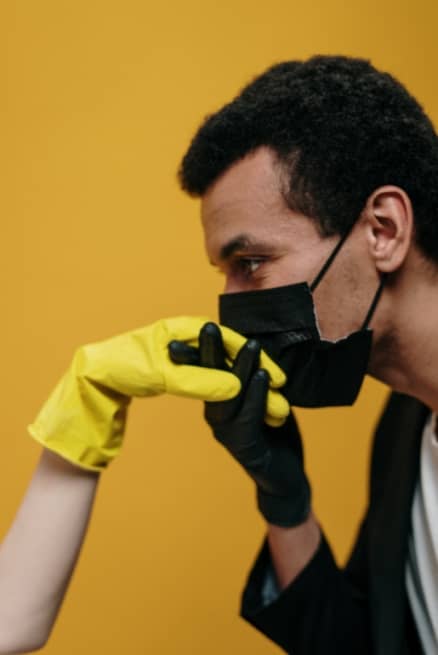 Photo of man kissing hand with face mask on Photo of man kissing hand with face mask on